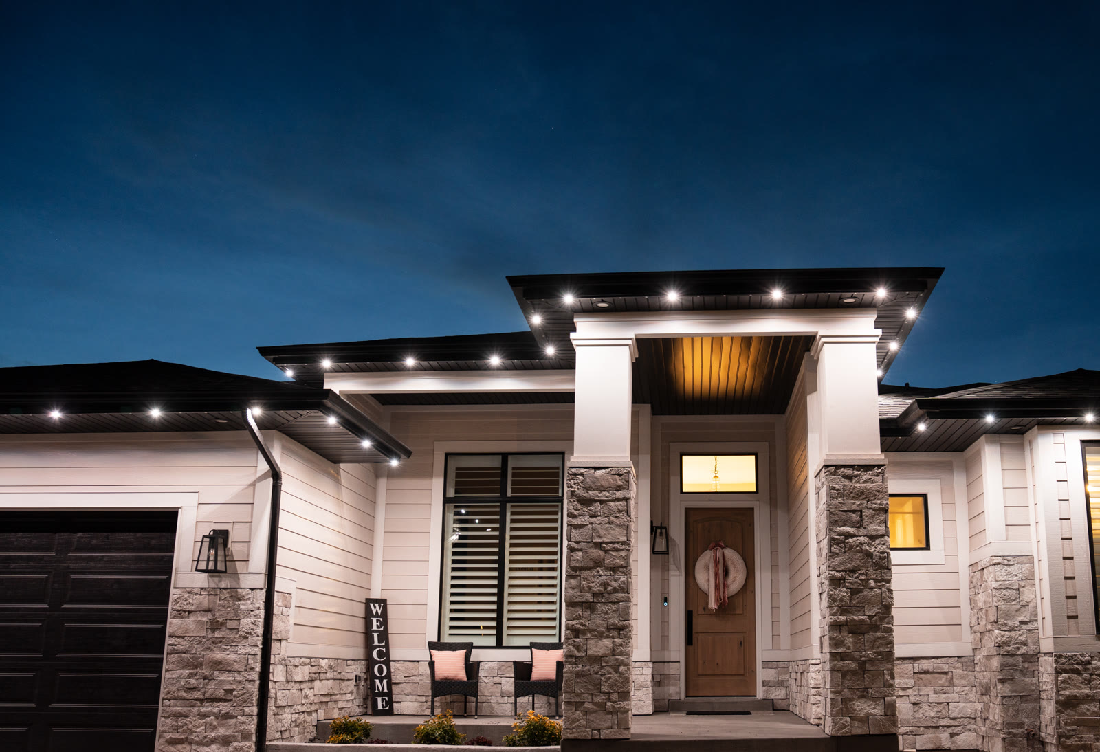 Bright cool-white security lighting on residential entrance