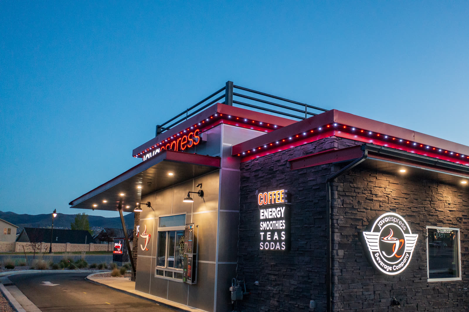 Real installs by tier — two-story facade install by Twilight Zone Permanent Lighting